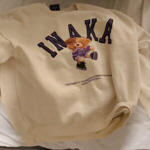 Inaka Power Cream Sweater with Purple Bear Graphic